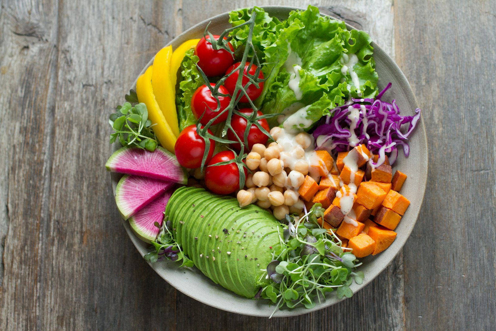 Fresh, colorful whole-food ingredients being prepared in a kitchen